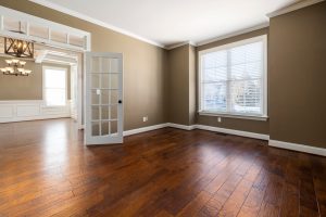 An empty living room and dining room.